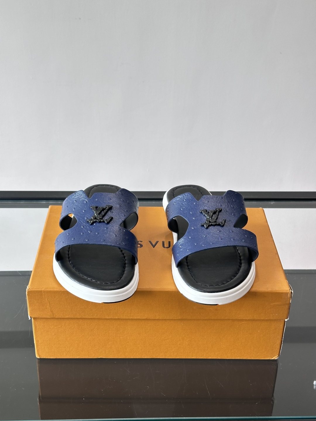 Louis Vuitton Embossed Blue Slide Sandals — front