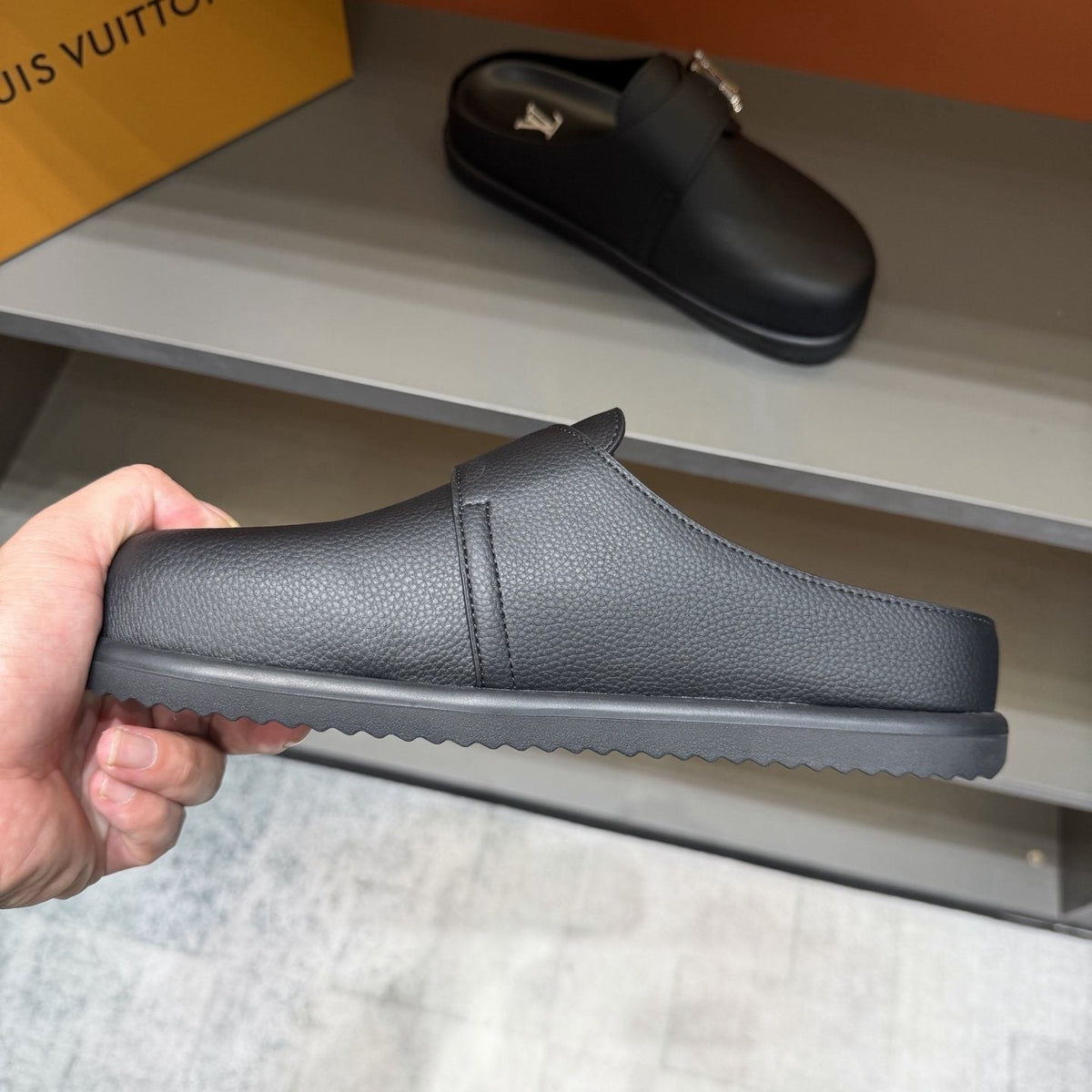 Louis Vuitton Textured Buckle Slide Sandals — hero