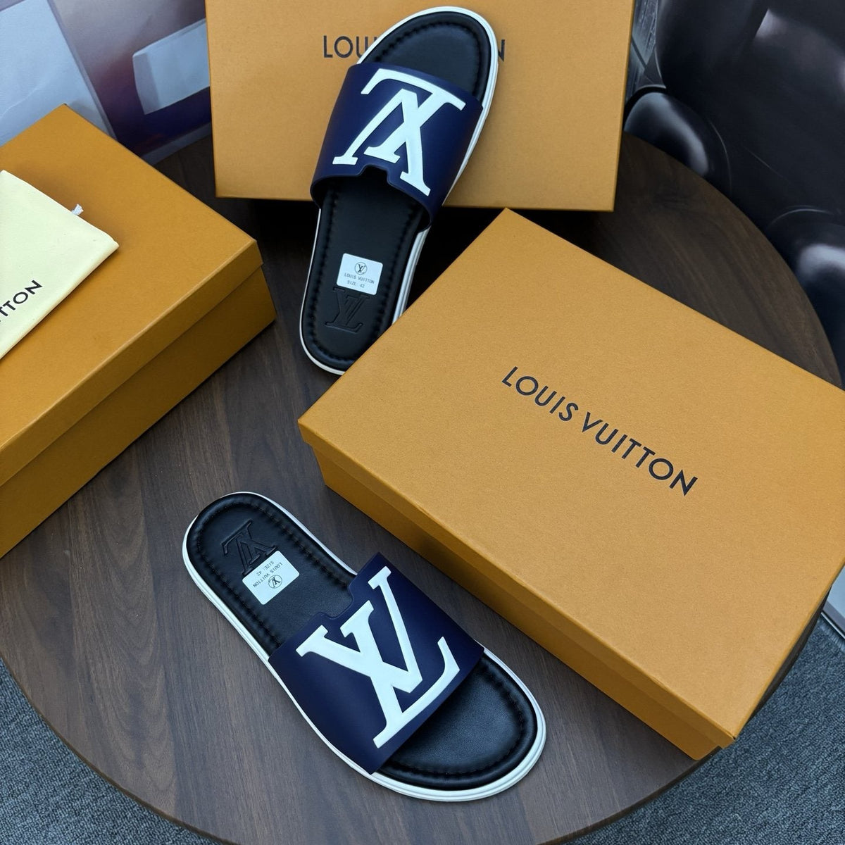 Louis Vuitton Raised-Monogram Slide Sandals — front