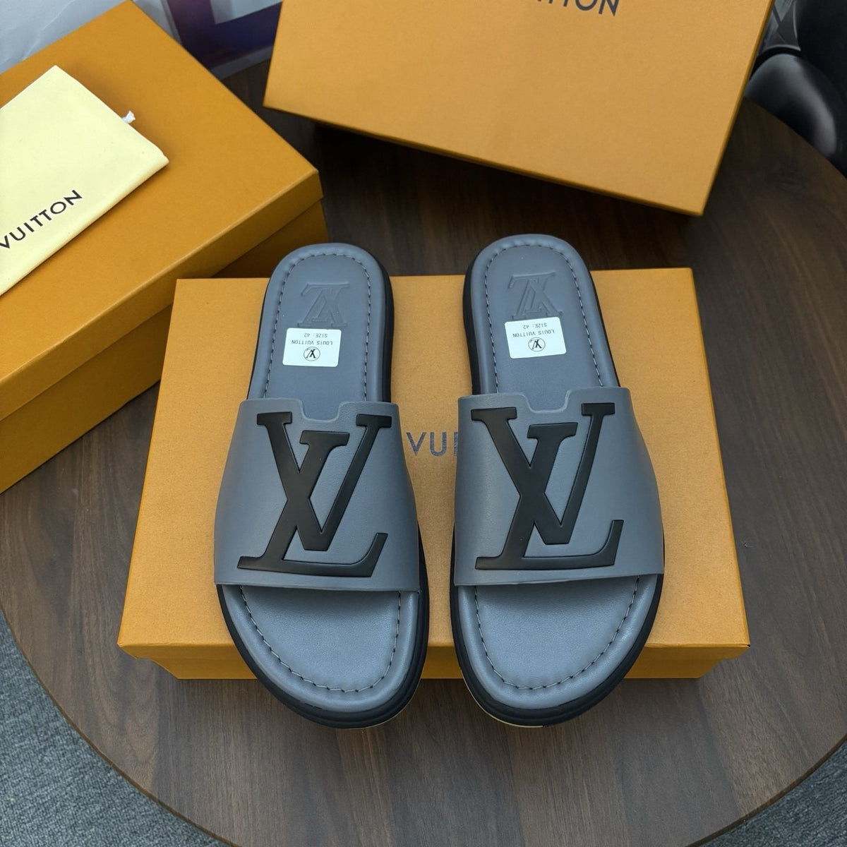 Louis Vuitton Raised-Monogram Slide Sandals — front