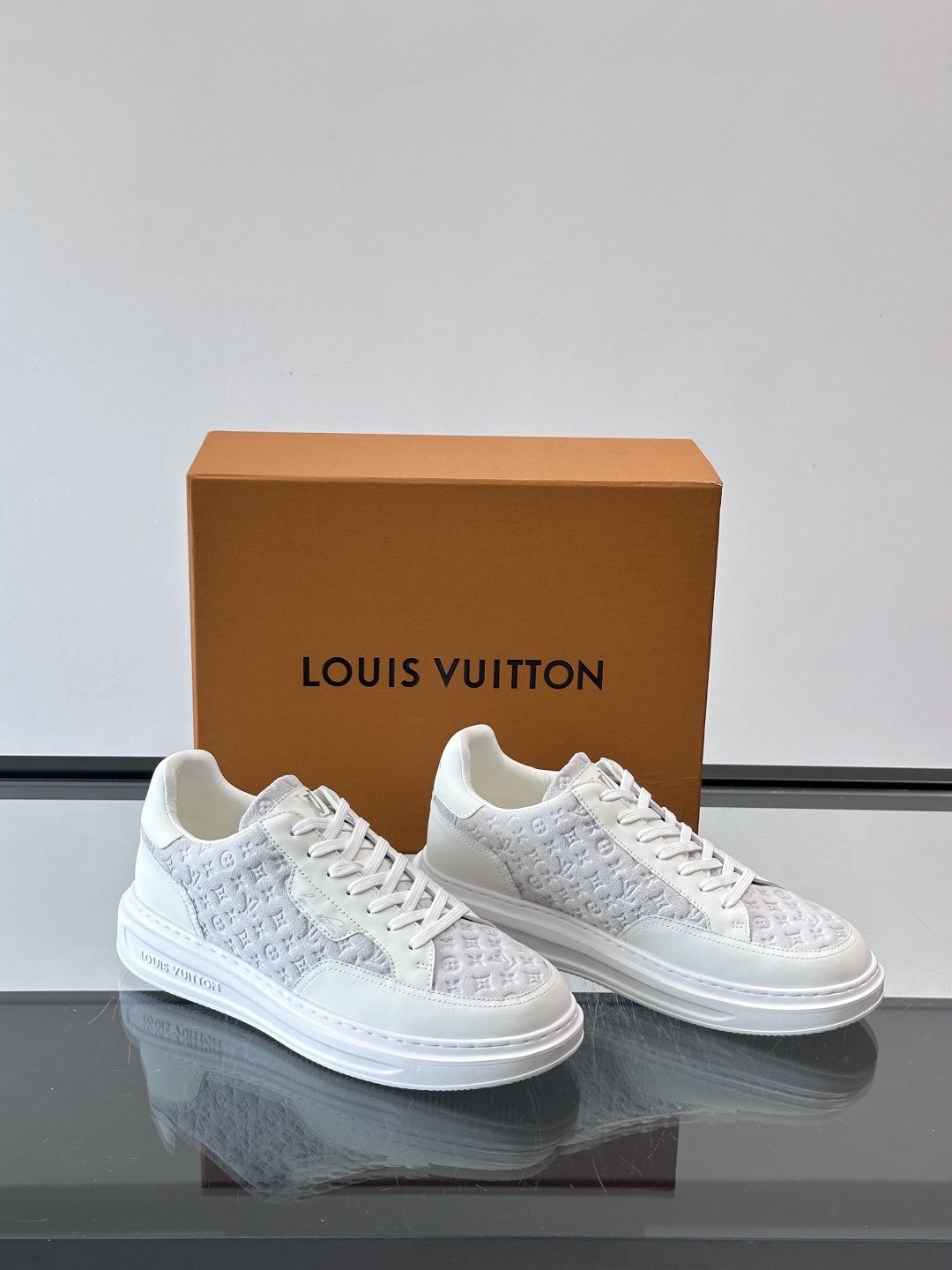 Louis Vuitton Embossed Low-Top Sneakers — front