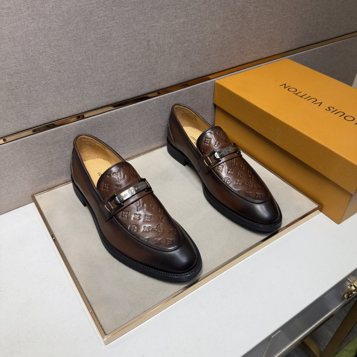 Louis Vuitton Embossed Metal-Bar Loafers — front