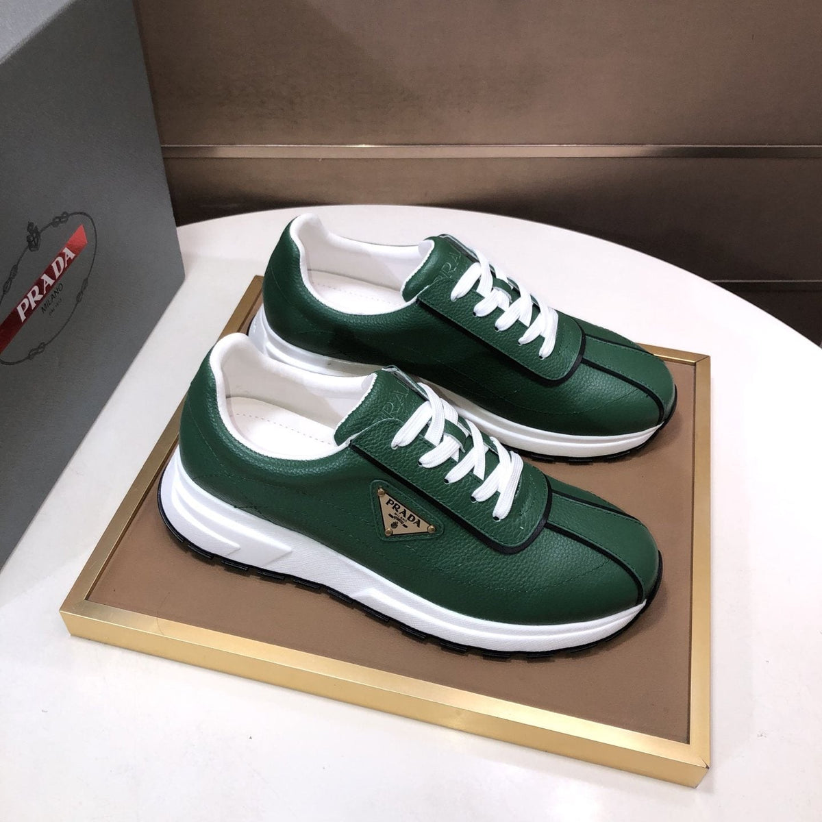 Prada Triangle Plaque Low-Top Sneakers — front