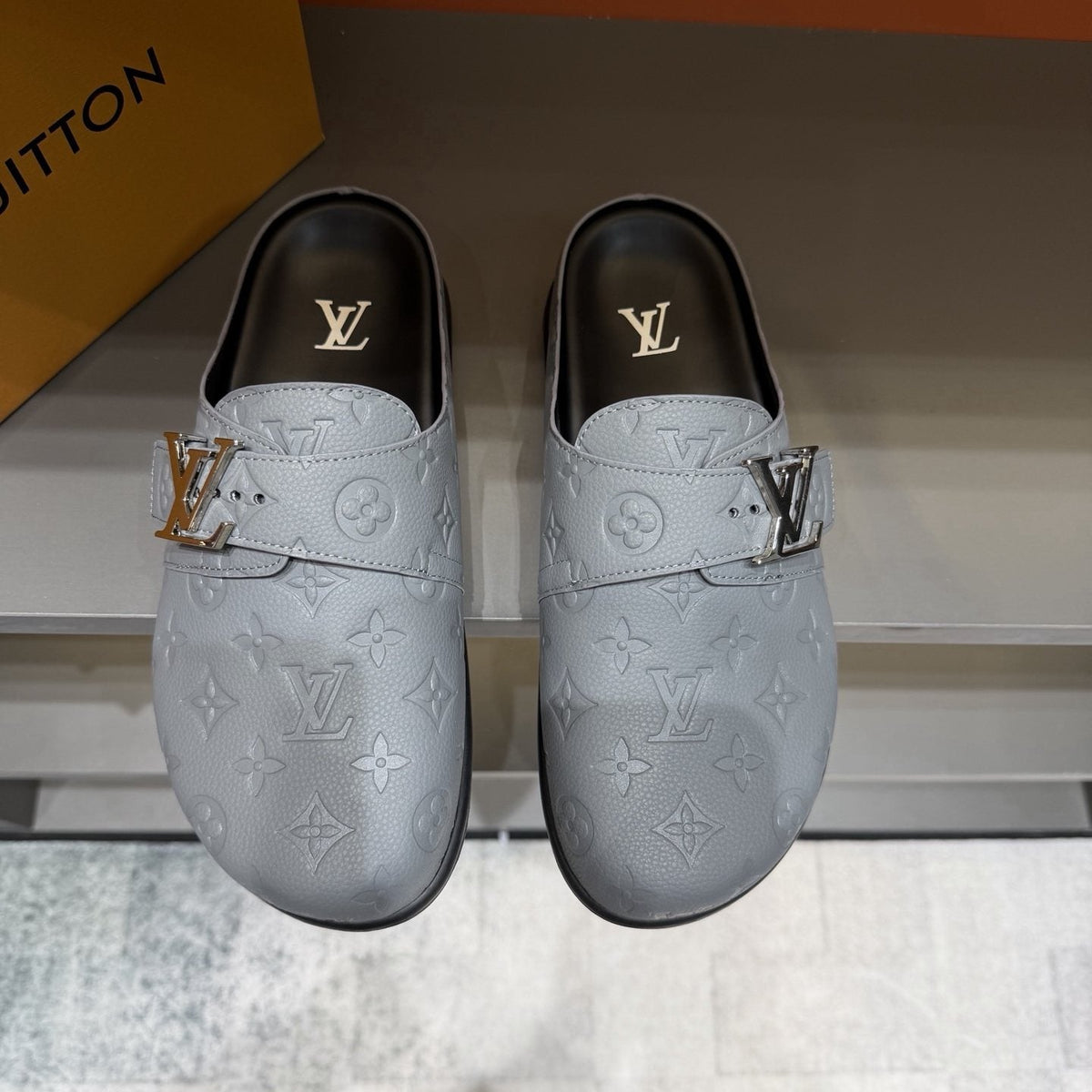 Louis Vuitton Embossed Buckle Slide Sandals — front