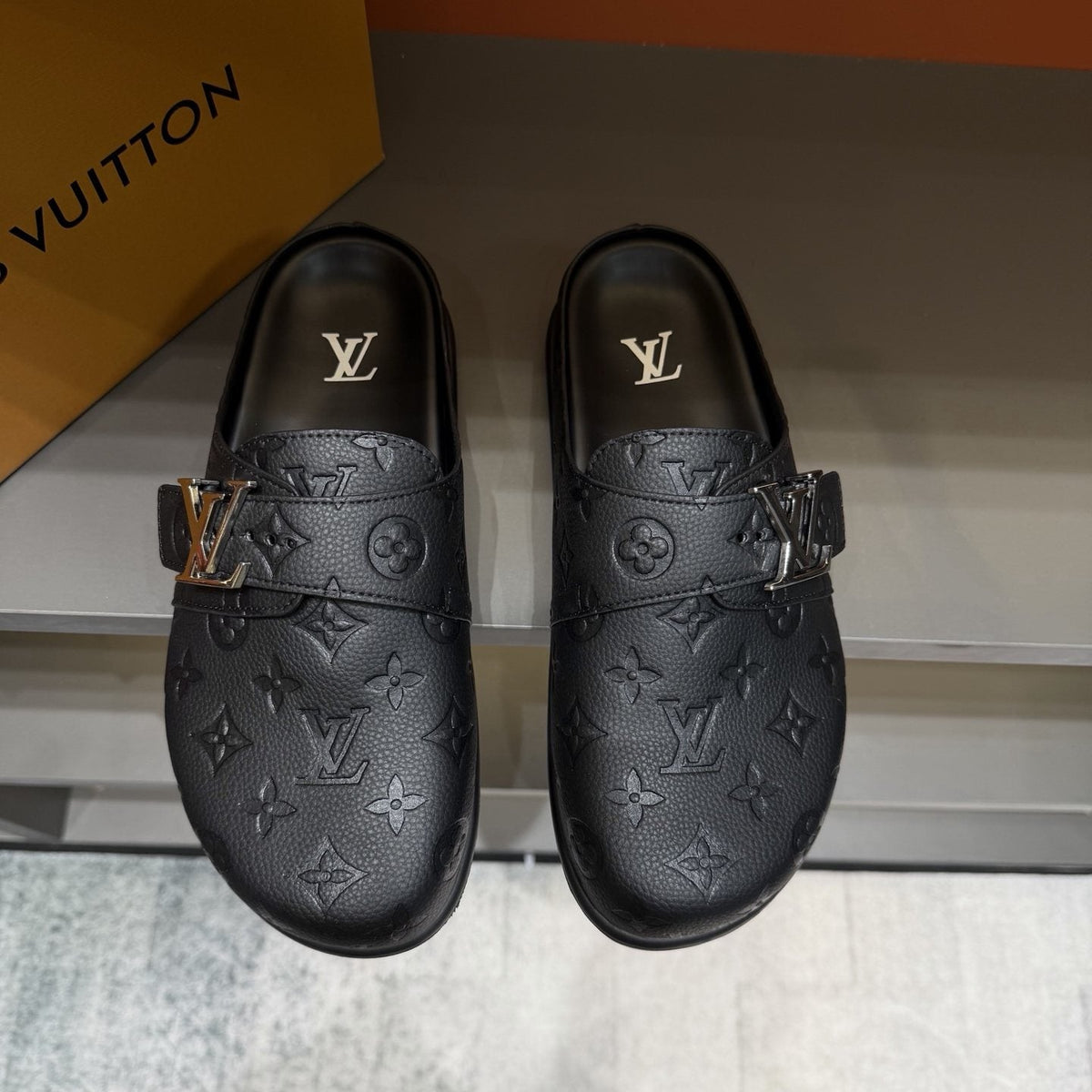 Louis Vuitton Embossed Buckle Slide Sandals — front