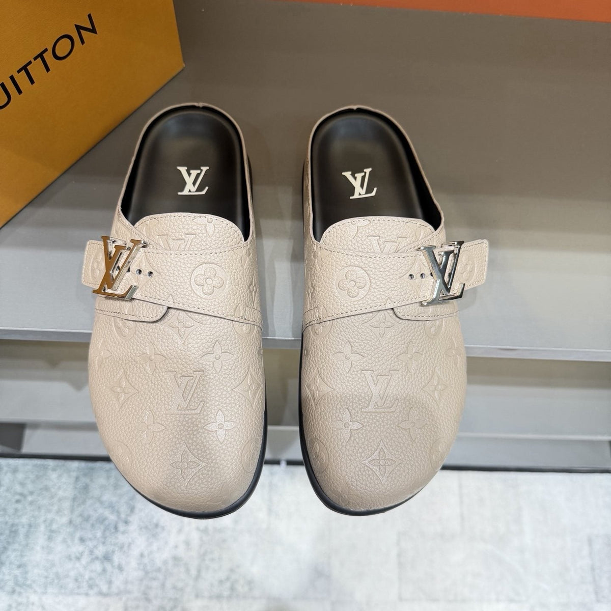 Louis Vuitton Embossed Buckle Slide Sandals — front