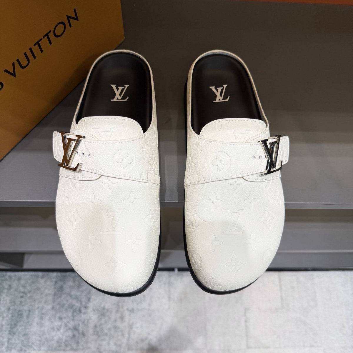 Louis Vuitton Embossed Buckle Slide Sandals — front