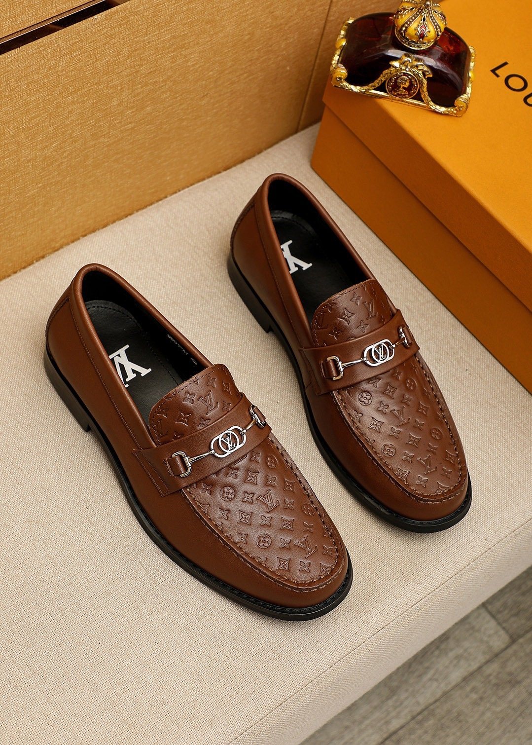 Louis Vuitton Embossed Buckle Loafers — front