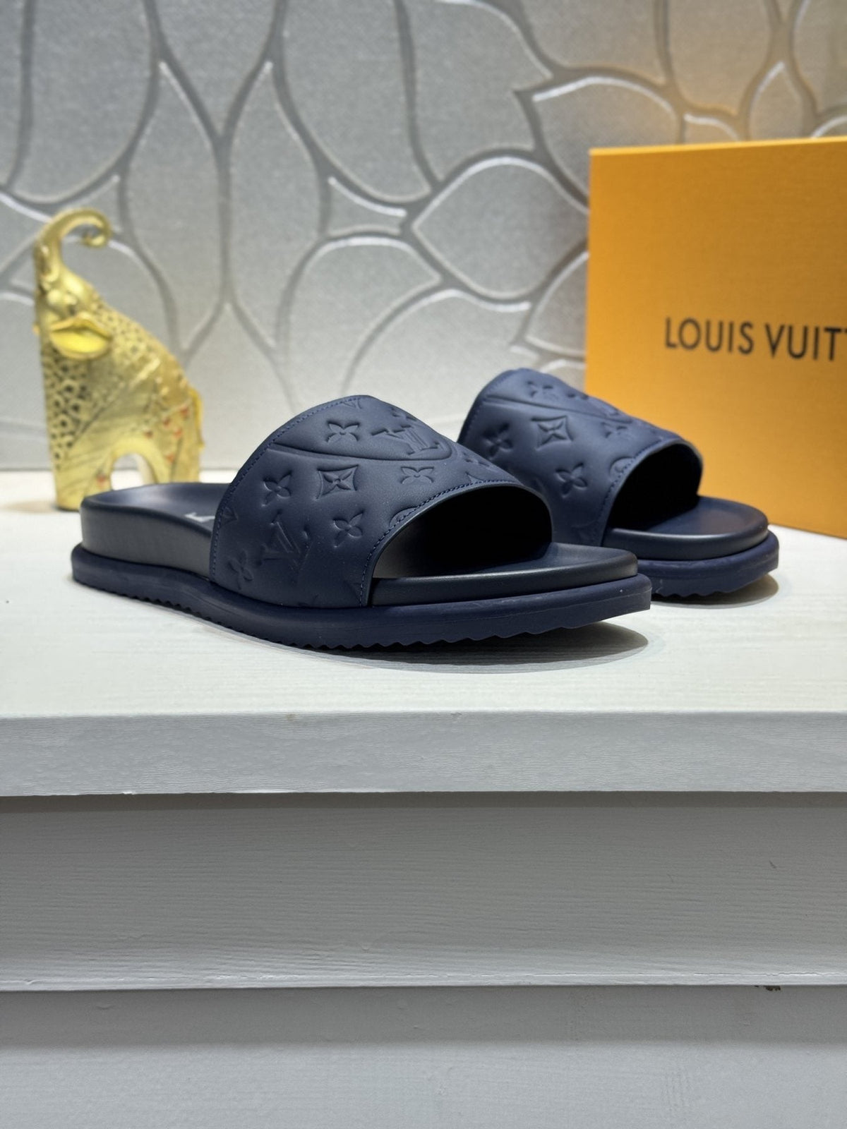 Louis Vuitton Embossed Slide Sandals — front