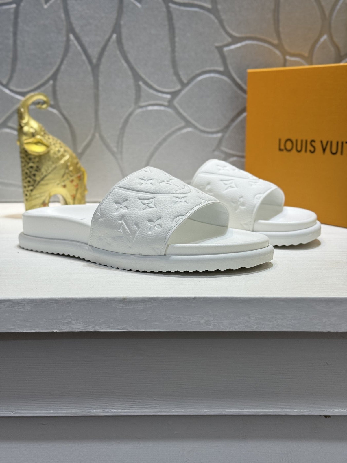 Louis Vuitton Embossed Slide Sandals — front