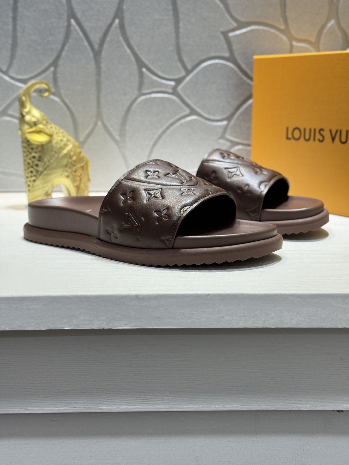 Louis Vuitton Embossed Slide Sandals — front