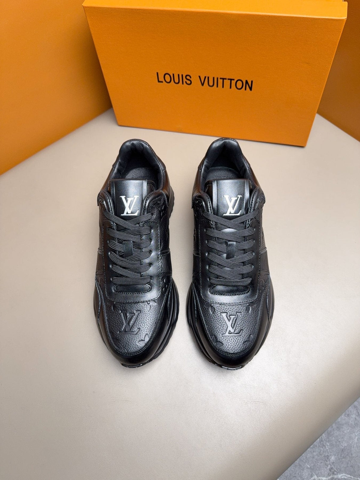 Louis Vuitton Embossed Low-Top Sneakers — front
